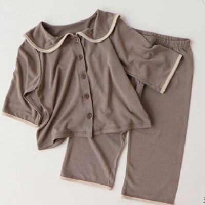 China Casual Oversized Loose Stylish Turn-Down Collar Kids Pajamas Top and Bottom Set for sale