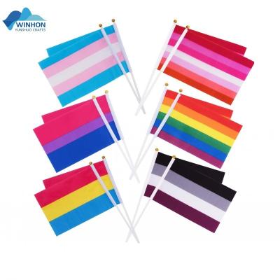 China Plastic Hand Flag Rainbow Hotel and Resort Stick Lesbian Gay Pride LGBT American Banner for sale