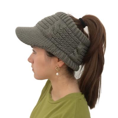 China Fashion 100% COMMON Fashion 100% Acrylic Ponytail Twisted Hat Women Knitted Warm Winter Knitted Hat for sale