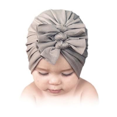 China Breathable Warm Style Kids Hats With Bowknots Cloth Skullcap 18 Colors Baby Newborn Infant Hats for sale