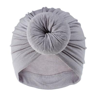 China Breathable Warm Style Kids Hats With Donut Cloth Skullcap 18 Colors Baby Newborn Infant Hats for sale