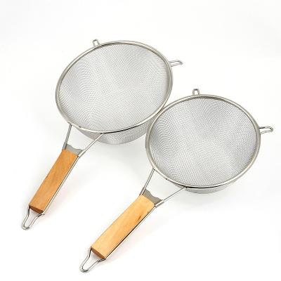 China Stainless Steel Stored Oil Fishing Wooden Handle Frying Basket Strainer Drain, Both Ears Can Be Hung With Kitchen Tools for sale