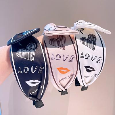 China Vintage Satin Headband Love Letter Printing Pattern Bow Headband Women Silk Hair Accessories Wholesale Friendly Material for sale