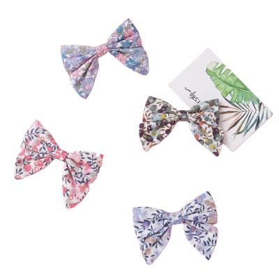 China Hot Selling New Sweet Bow Style Korean Floret Pure And Fresh Hairpin For Kids Girl for sale