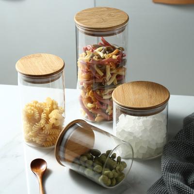 China Freshness Preservation Kitchen Glass Canisters Clear Glass Food Storage Jar With Airtight Bamboo Lids for sale