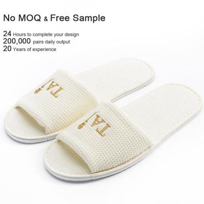 China Four Seasons Women's and Men's Hotel Disposable Beige Waffle Embroidered Customs House Slides Slippers for sale