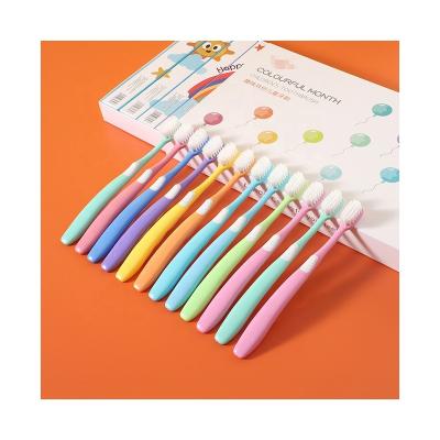 China New Design Reusable High Quality Pretty Macarone Colored Soft Hair Cleaning Oral Care Child Gingival Toothbrush for sale