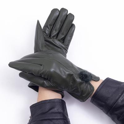 China Simple Top Quality Sheep Leather Gloves Winter Cycle Stylish Fur Ball Decor Leather Gloves For Women for sale