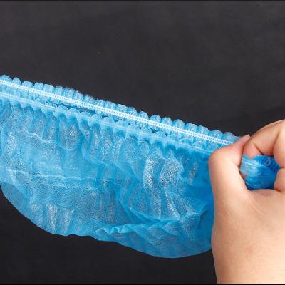 China Sustainable Quality Material Stocked Hair Nonwoven Disposable Shower Cap for sale