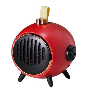 China Hotel Portable Desktop Heater PTC 200w Cute Electric Fast Heating Home Mini Desktop Room Fan Heater for sale