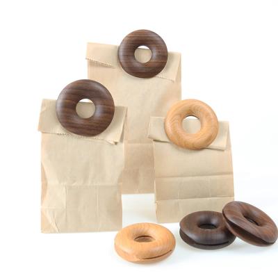 China Sustainable Beech Walnut Wooden Donut Seal Pour Food Storage Bag Clip Snack Sealing Clip for sale