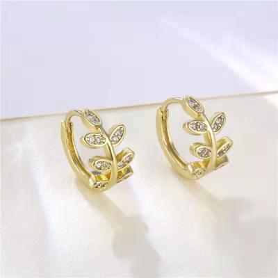 China 2021 Other Women's Ear Zircon Leaf Earrings Hollowed Out Earrings Set With Cool Leaf Diamond Gold Forest Diamond Earrings for sale