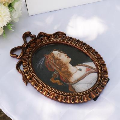 China European style antique resin hollow-out picture frame embossed picture frame home table hanging home old resin double function frank for sale