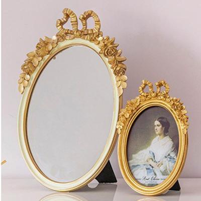 China Retro Arc Resin Minimalist Oval Cosmetic Creative Home Soft Mirror Decoration Can Be Hung On The Wall for sale