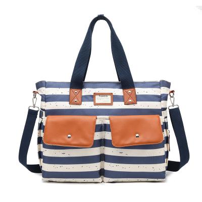 China Portable Multi-Function Shoulder Mommy Bag Single Package Leisure New One Can Keep Warm Baby Stroller Bag Stripe Canvas Diaper Bag for sale