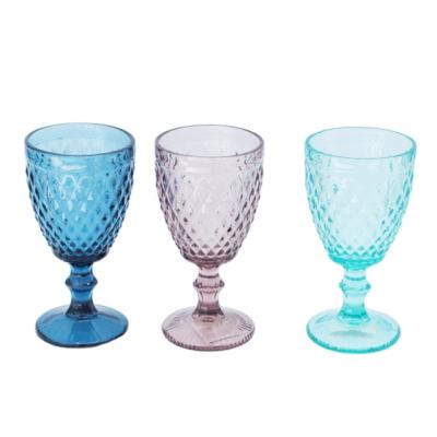 China Viable Machine Pressed Elegant Cheap Embossed Wedding Colored Goblet Glass Wine Glass for sale