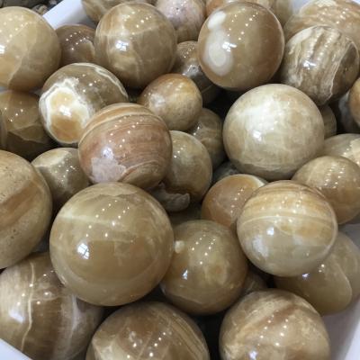 China China Wholesale Natural Yellow Massage Ball Jade Sphere Crystal Healing for sale