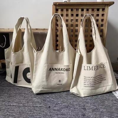 China Low MOQ Folding Customization Printed Calico Canvas Fabric Lifestyle Logo Bags Eco-Friendly Reusable Grocery Tote Bag Vest Shopping Bags for sale