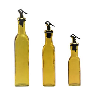 China 170ml/250ml/520ml Viable Yellow Glass Spice Jar Oil Bottle With Oil Dispenser for sale