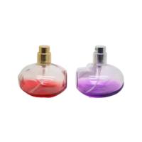 China 100ml round apple perfume bottle with uv apple cap for sale