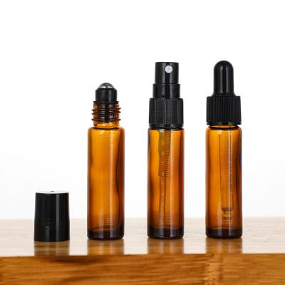 China Glass Essential Oil Roller Bottles With Stainless Steel Ball 10ml Amber Roll On Perfume for sale