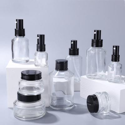 China 100ml push refillble glass perfume bottle transparent lotion bottle glass cream bottle for sale