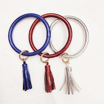 China Wholesale Glitter Leather Wristband Fringe PU Keychain Promotion Gift Big Circle O Key Chain With Tassel for sale