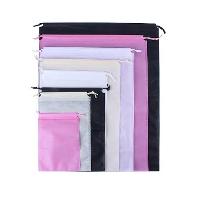 China Custom Made Pink Black Beige 25*30Cm Polypropylene Recyclable Laminated Running Logo Nonwoven Gift Shoe Drawstring Bags for sale