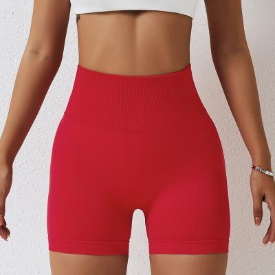 China Nylon ammonia blend Seamless high waisted yoga shorts with hip lifting and belly tightening tight shorts for training, running, and fitness for sale