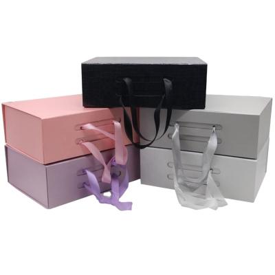 China Recyclable Rigid Collapsible Cardboard Magnetic Folding Packaging Gift Box Recyclable With Ribbon for sale