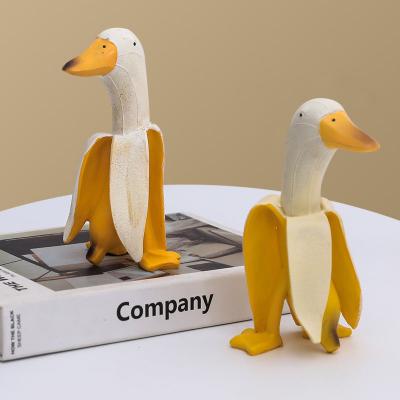 China Funny Modern Innovative Banana Duck Resin Statues Creative Yellow Green Outdoor Figurines For Garden Decoration Gifts for sale