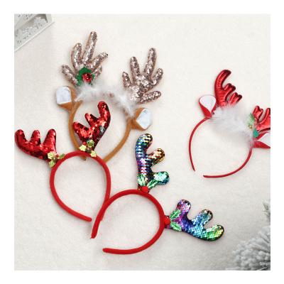 China Hot Selling Nonwoven Fabric Christmas Headband For Adult And Kid Accessories Party Headband Reindeer Antler Santa Headband for sale