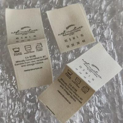 China 1000pcs Cotton Soft Care Labels, Custom Natural 2.5*6.7cm Cotton Wash Label Cloth Label Buckle Fold for sale