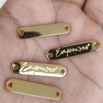 China 1000PCS Washable, 2.7*0.6 cm Metal Color Sewing Labels Custom Shiny Gold Zinc Alloy Hand Label for sale