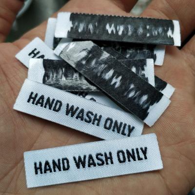 China Hot Iron On Iron On Labels 100PCS, 4.5*1.2cm Hot Selling Hot Melt Stick Black/White Straight Cut Cloth Label Hand Wash Labels Only for sale