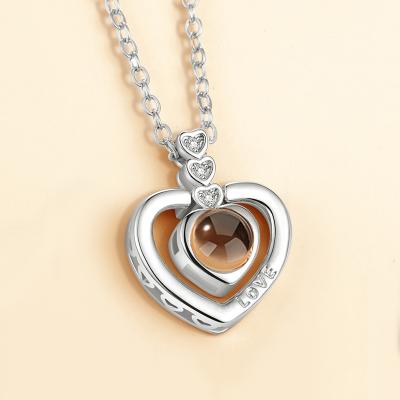 China Valentine's Day Gift Couple Jewelry Fashion Heart Shaped Pendant Necklace 100 Languages ​​Romantic Projection I Love You for sale