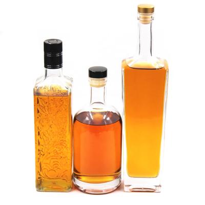 China Custom Beverage 500ml 700ml 750ml Premium Taper Exclusive Tall Liquor Sensitive Spirit Vodka Whiskey Rum Glass Bottle With Cork Top for sale