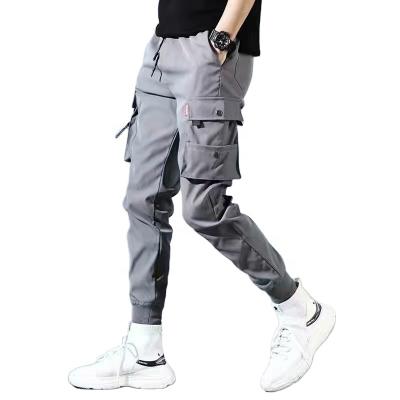 China Breathable OEM Custom Design Mens Solid Color Drawstring Pants Multiple Pocket Yoga Cargo Long Pants for sale