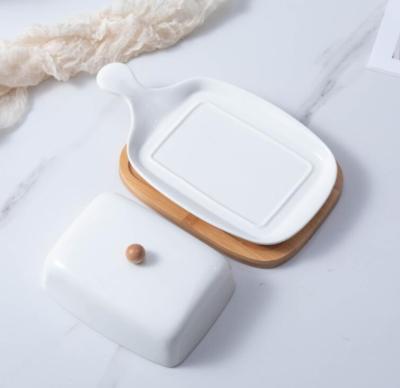 China Sustainable White Luxury Ceramic Butter Dish Set Bamboo Dish With Lid Western Ceramic Butter Cheese Box Set for sale