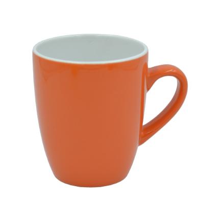 China Bullet Shape Promotion Mug Sustainable Ceramic Bright Orange Color Glazed Porcelain 10oz Coffee Mug for sale