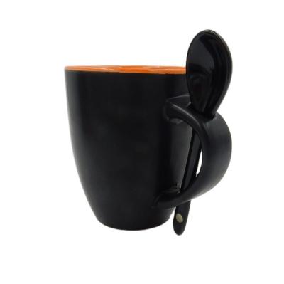 China Sustainable Inner Orange Outside Matte Black Color Coffee Mug / Ceramic Mug With Spoon In Handle for sale