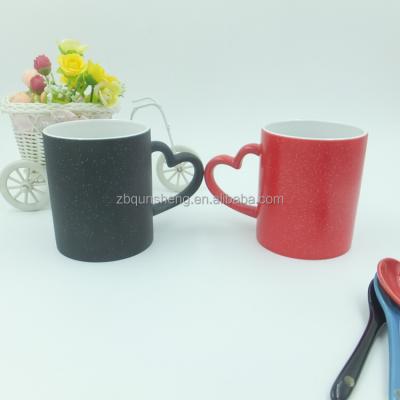 China Red Color Viable Black Magic Transfer Ceramic Mug With Heart Handle for sale