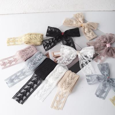 China Viable Wholesale Colorful Handmade DIY Mesh Embroidery Lace Bow Headwear Clothing 4CM Handmade Bow for sale