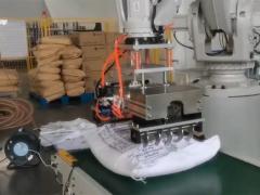 ABB Robotic arm depalletizer machine breaks bags and unpacks rice, sugar, and coffee beans on-site