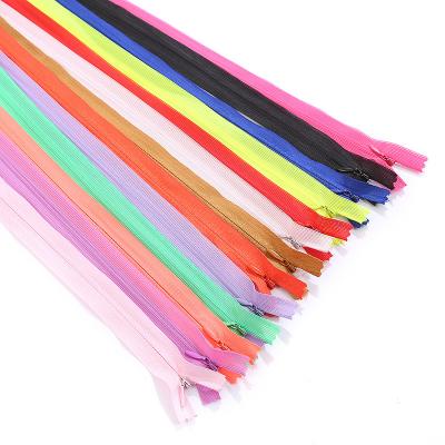 China Automatic lock factory direct sale all kinds of color matching invisible belt nylon zipper for sewing clothes for sale