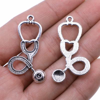 China Vintage 100pcs/bag 23x41mm Antique Silver Plated Bronze Plated Zinc Alloy Stethoscope Charms Pendants ABD-C11187 for sale