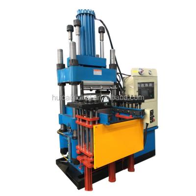 China Professionele 12000 Spanning 220v Verticale Rubber Injection Molding Machine Te koop