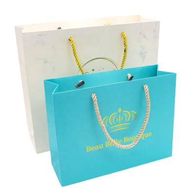 China Recycled Materials Paper Bag Manufacturer White Luxury Customize Logo Printed Paper Shopping Bags for sale