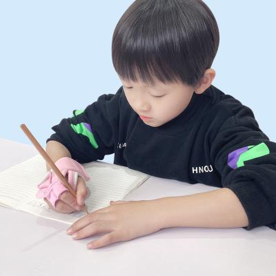 China JLK Advance Children Seat Pen Tool Device Orthotics Learning Writing Correction Pencil Writing Aid Handle for sale