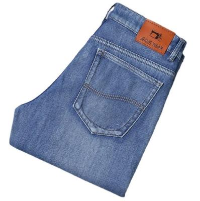 China Calças de ganga de outono para homens, de tecido denim de alongamento leve para movimento respirável à venda